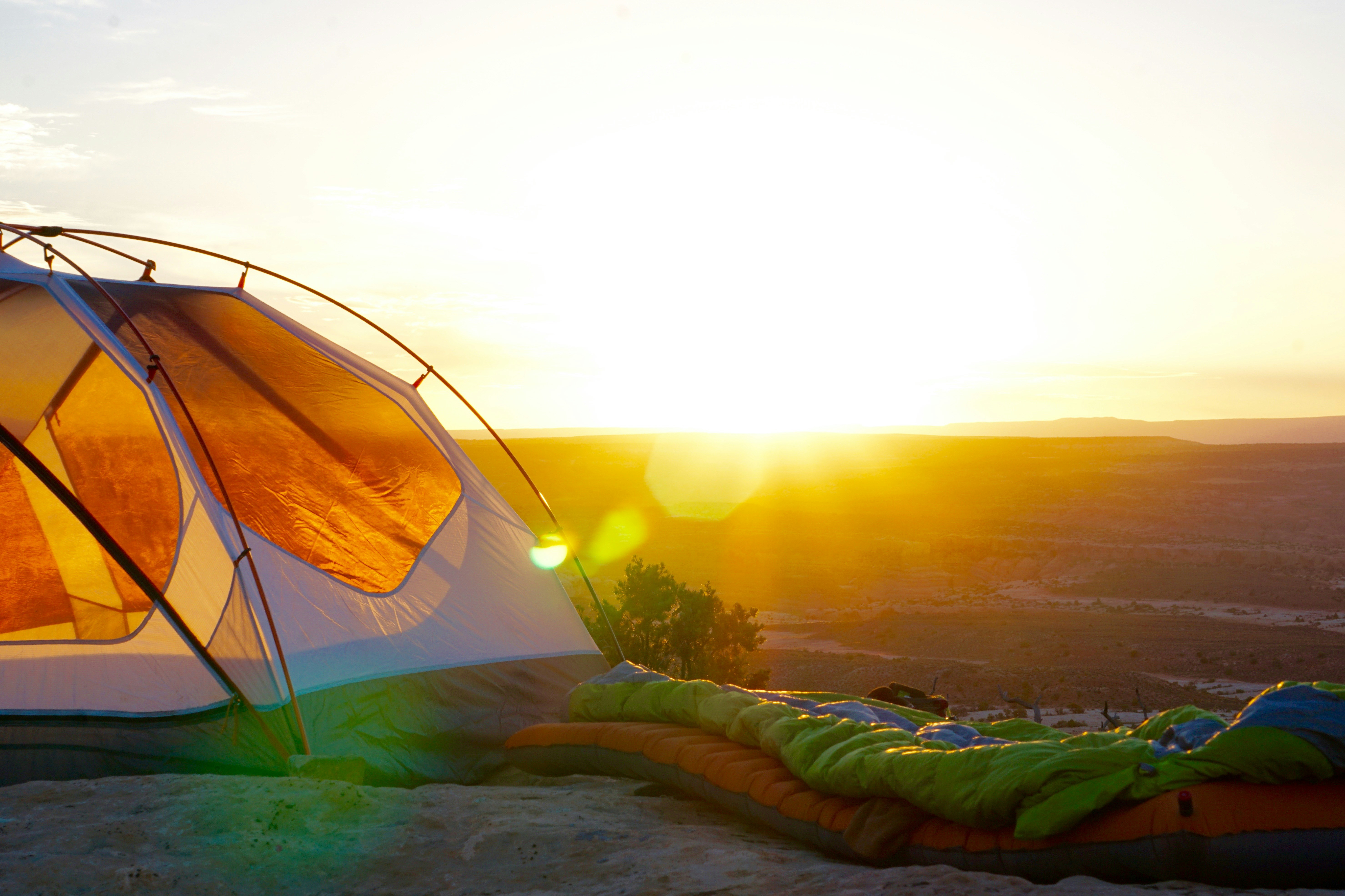 Outdoor gear laid out at a mountain campsite